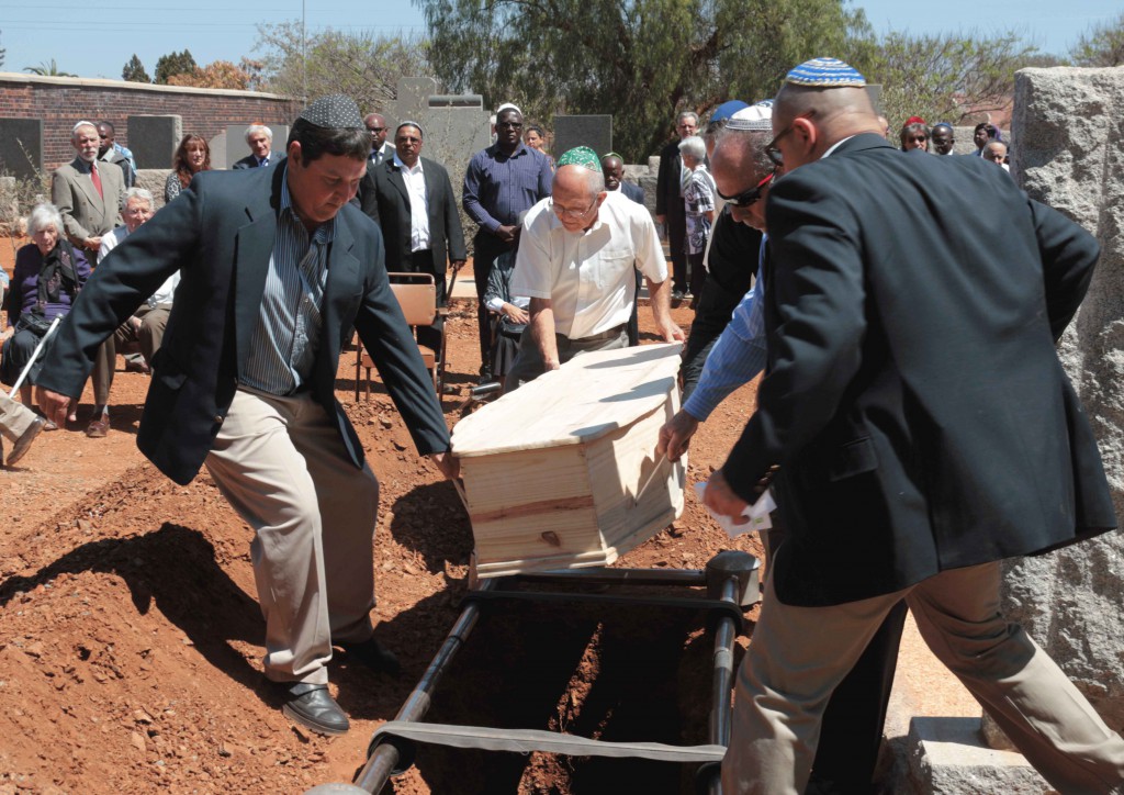 Rest in peace: Dr Eric Bloch was buried in a simple casket - Jewish tradition teaches that the deceased should be buried in a simple casket