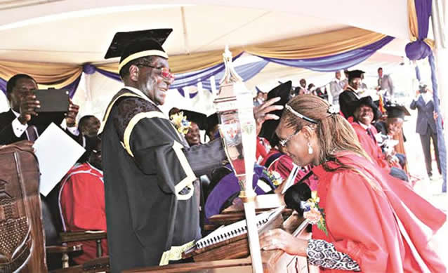The First Lady Cde Grace Mugabe and Vice-President  Cde Joice Mujuru yesterday graduated with Doctor  of  Philosophy degrees at the 59th University of Zimbabwe graduation   ceremony at which  President Mugabe capped a total of 3,274 graduands in  various disciplines. In the picture collage, President Mugabe caps the First Lady (above) and congratulates Vice President Mujuru (below) 