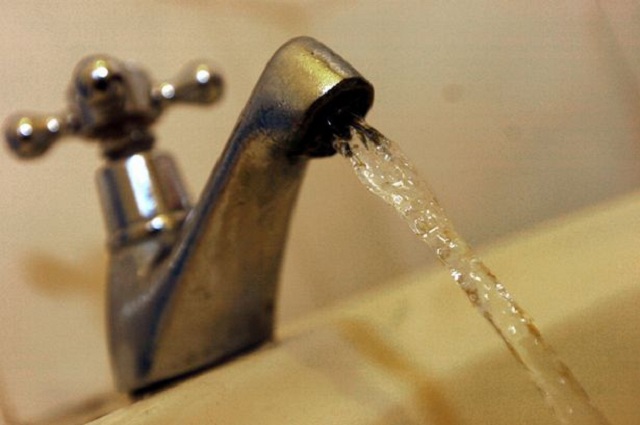 close up of running tap