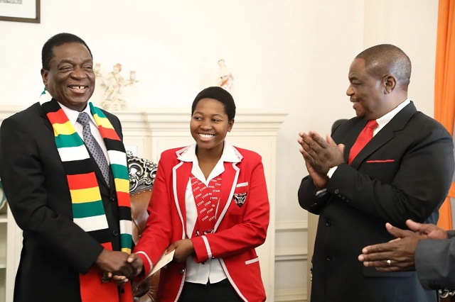 President Mnangagwa and VP Chiwenga congratulate Primrose Thandeka Tshuma of John Tallach High School who came second in a Sadc essay competition. The pupil received $2 000 from the Head of State.