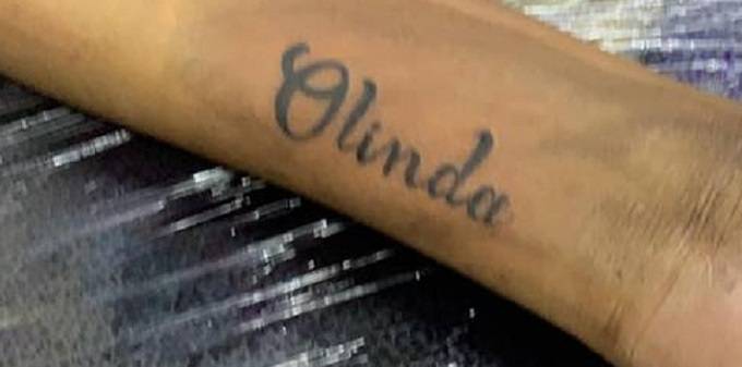 Tytan inks Olinda’s name on forearm