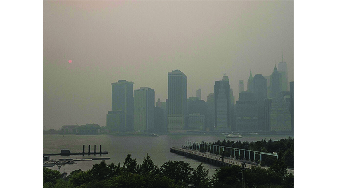 Canada wildfires: Smoky skies disrupt life in New York City