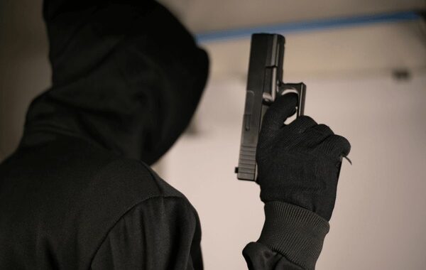 Manhunt for masked armed robbers who stole US$22 400